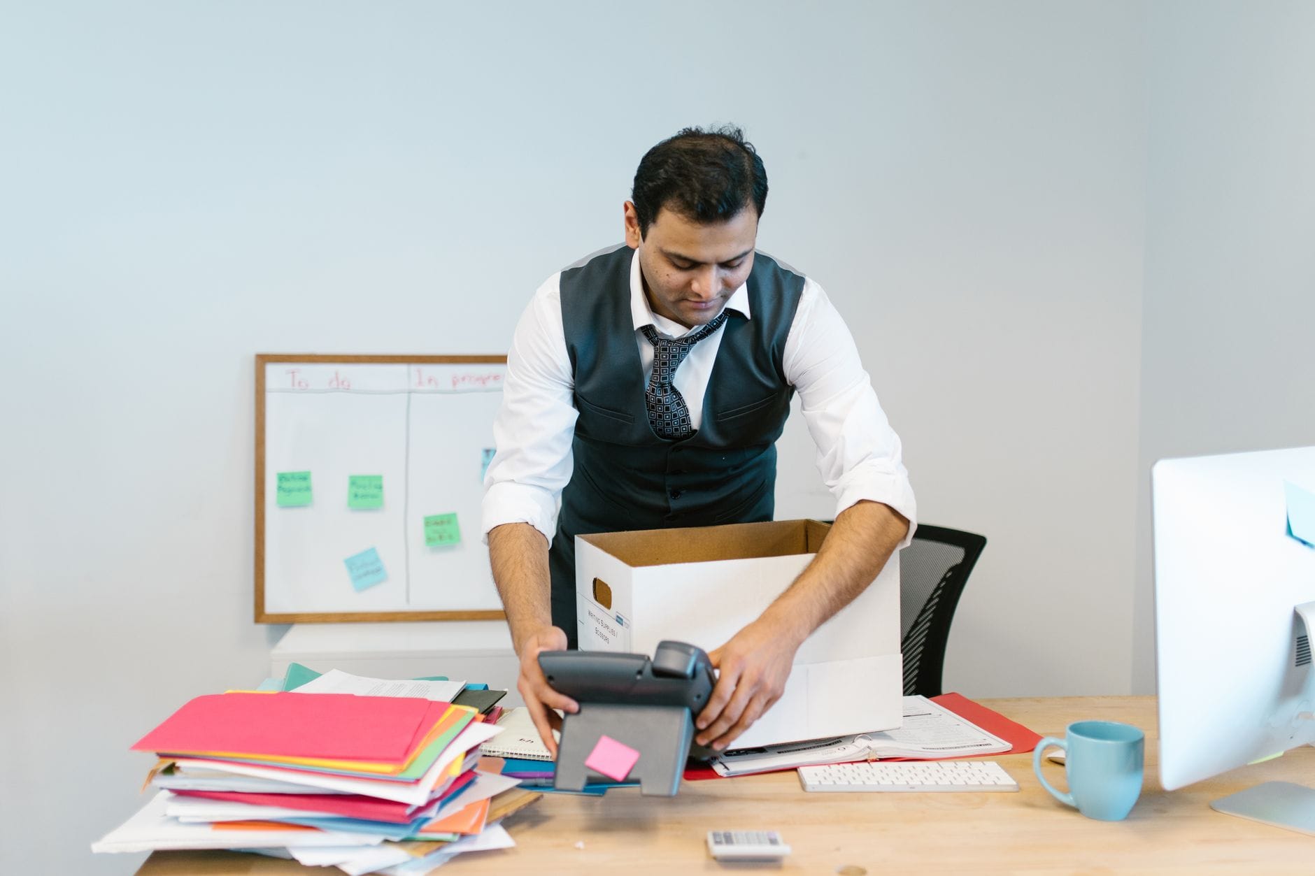 Office worker at a desk reviewing documents