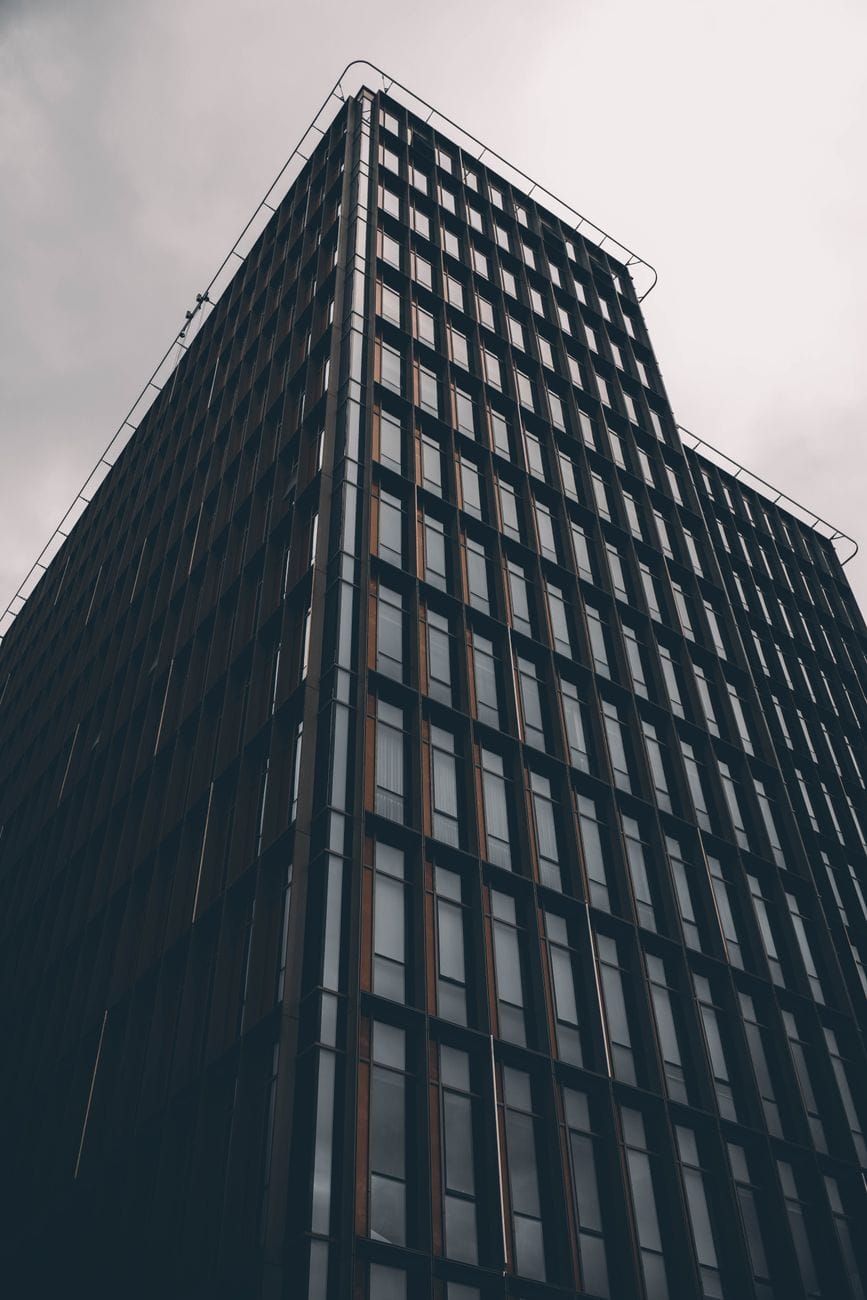 Modern corporate office building viewed from below