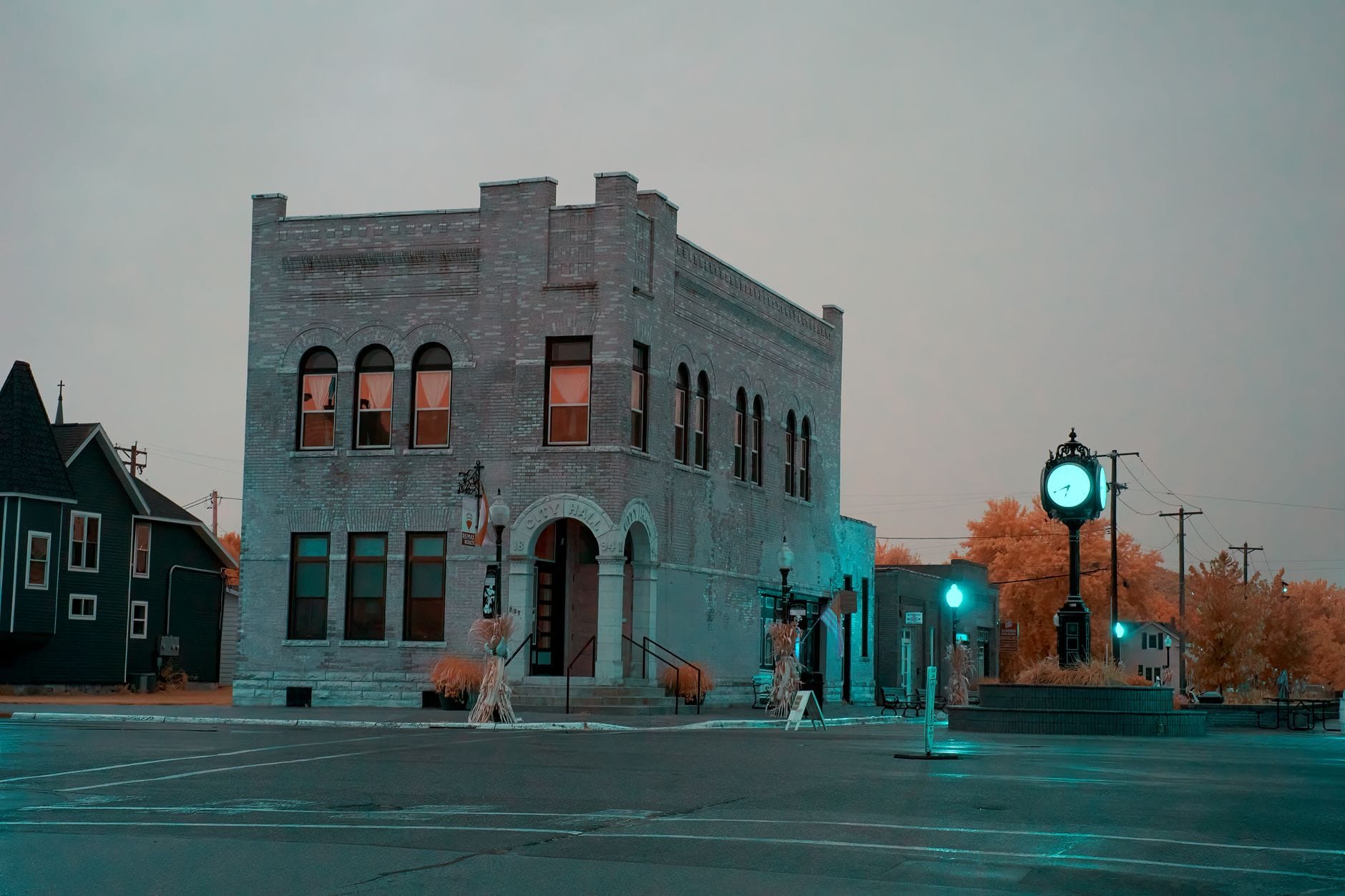 Historic brick building at a small town intersection at dusk