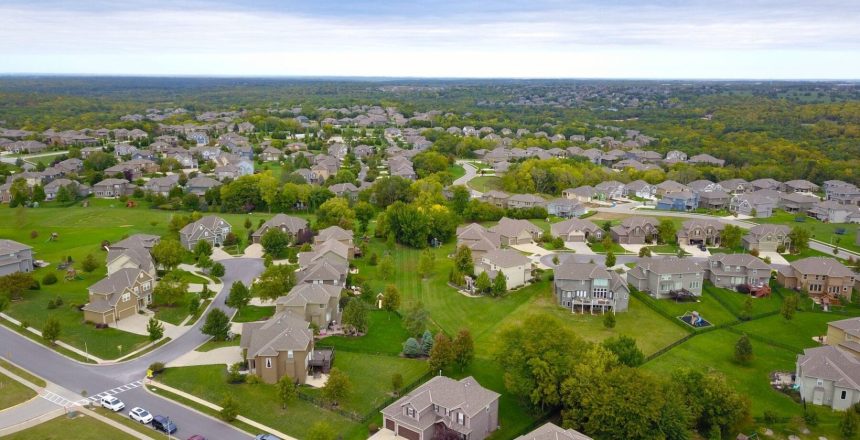 Aerial view of a Saskatchewan residential neighbourhood with single-family homes and tree-lined streets