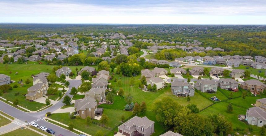 Aerial view of a Saskatchewan residential neighbourhood with single-family homes and tree-lined streets