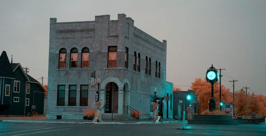 Historic brick building at a small town intersection at dusk